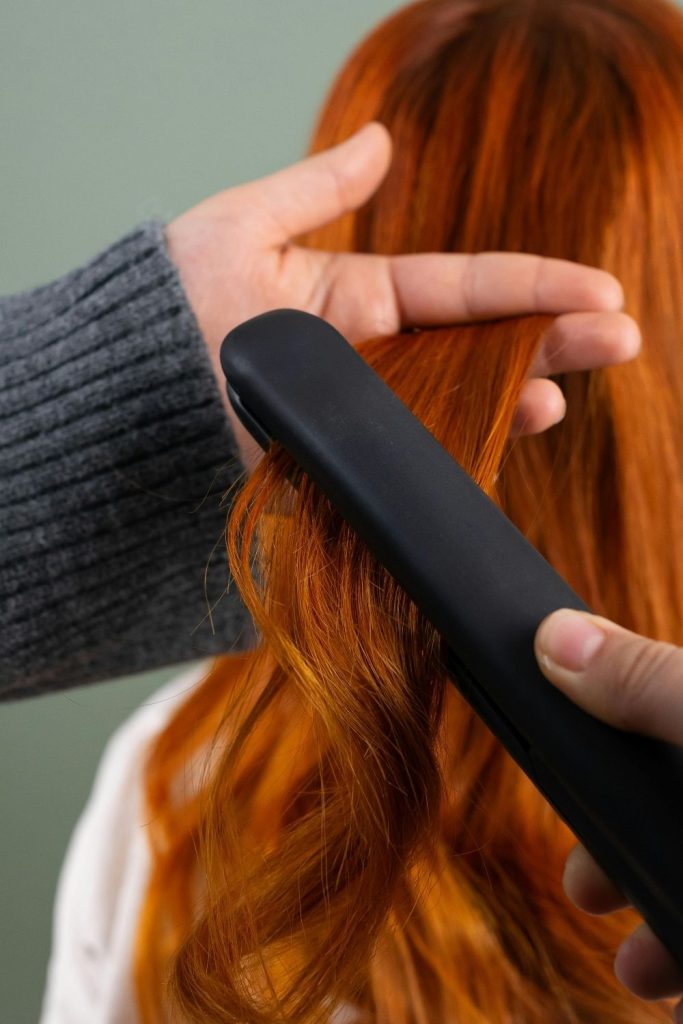 curling hair with a flat iron